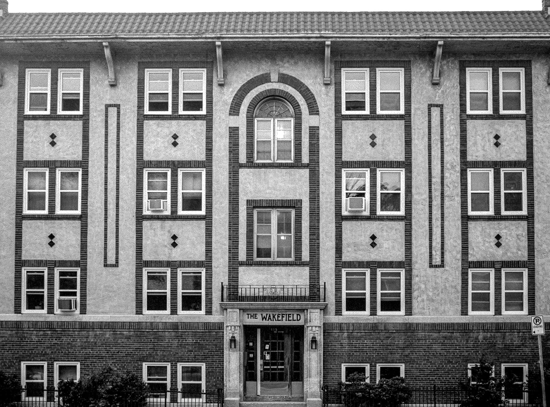The Wakefield — the symmetrical brick and stucco facade of an apartment building